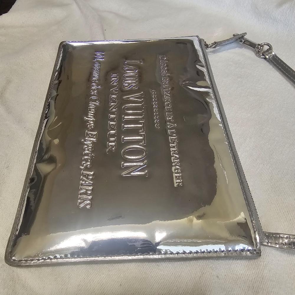 Authentic Louis Vuitton Silver Monogram Miroir Platt Pochette Bag M95277